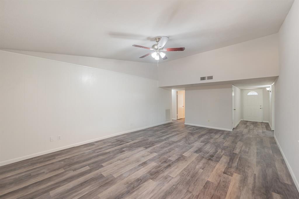 2038 Ash Hill Road Carrollton, TX 75007 - Photo 22 of 28 a view of empty room with wooden floor and fan