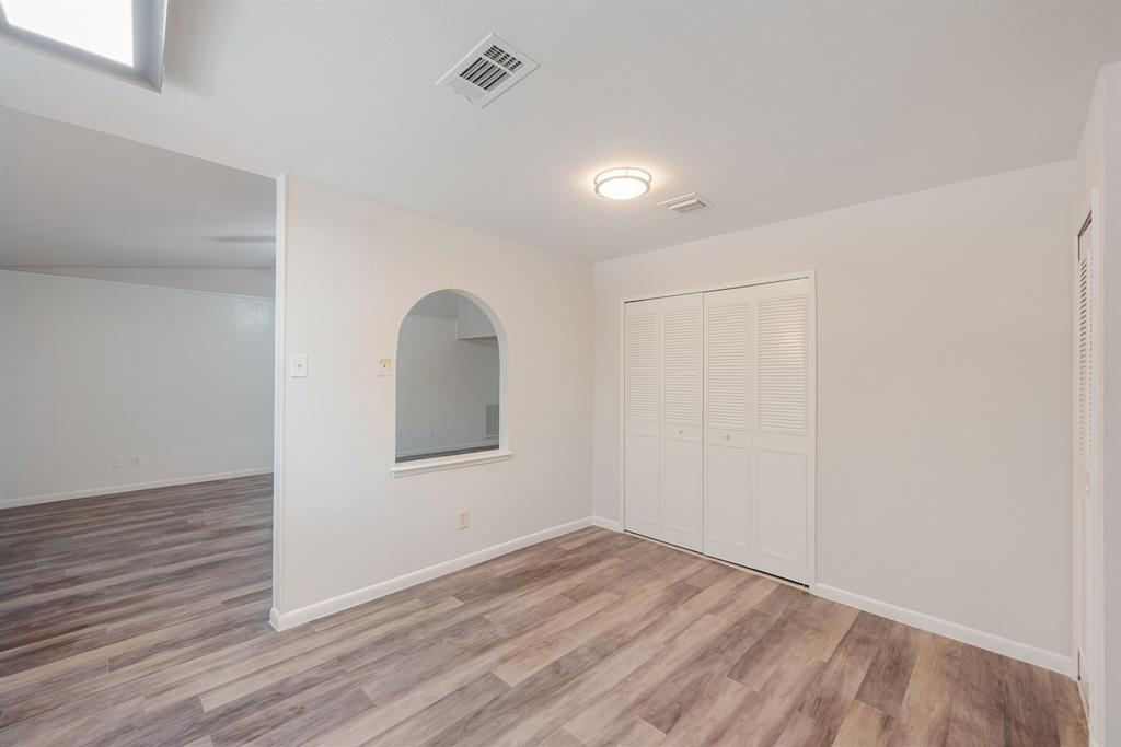 2038 Ash Hill Road Carrollton, TX 75007 - Photo 26 of 28 a view of a livingroom with wooden floor and a window