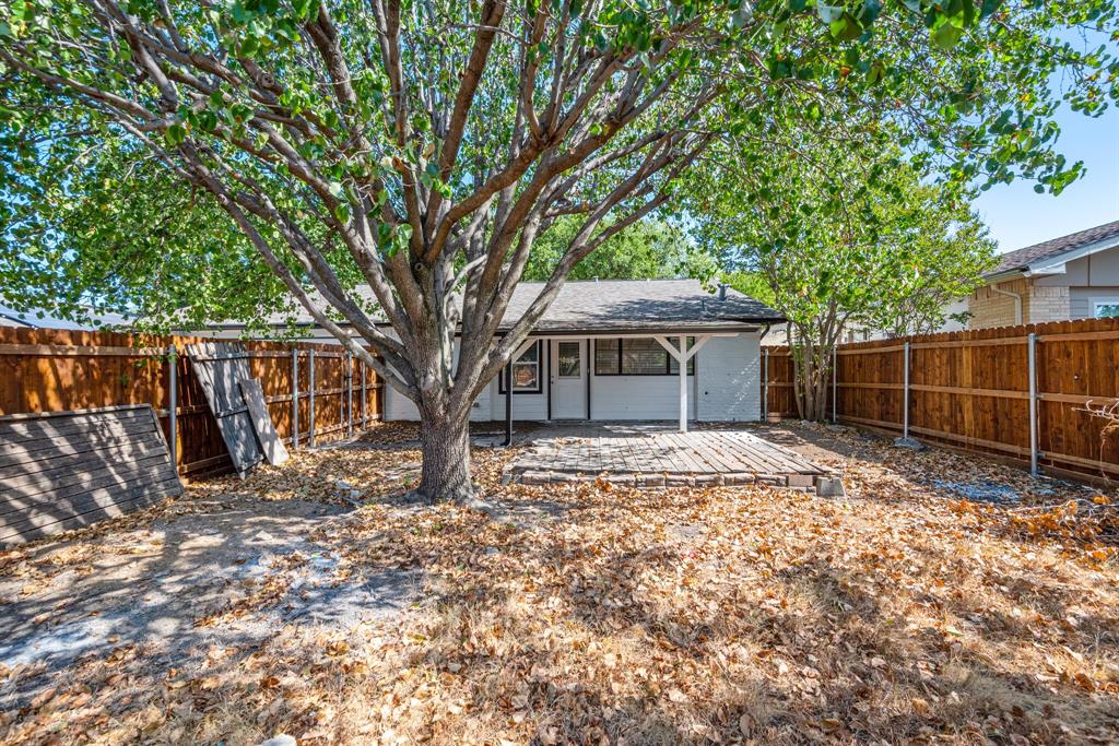 2038 Ash Hill Road Carrollton, TX 75007 - Photo 6 of 28 a house with trees in front of it