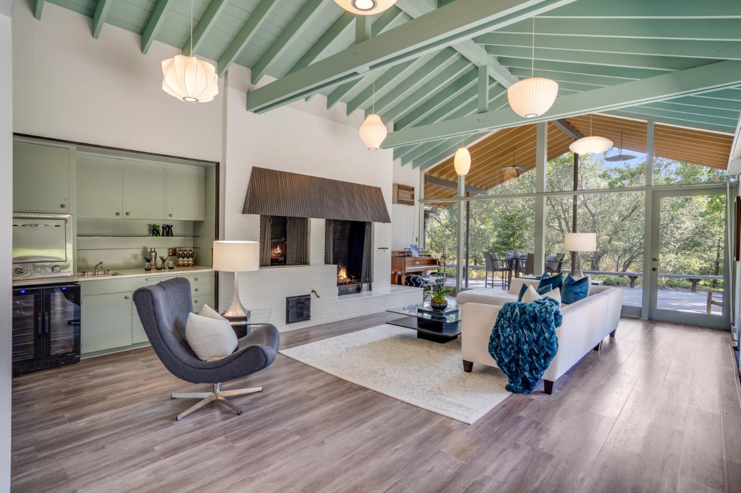 760 Chiltern Road Hillsborough, CA 94010 - Photo 12 of 56 a living room with furniture a rug water view and a large window