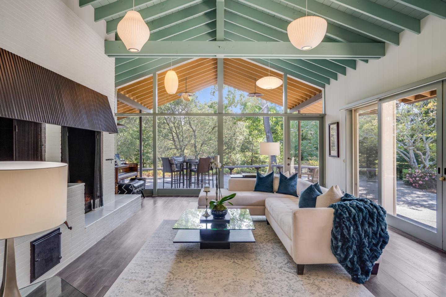 760 Chiltern Road Hillsborough, CA 94010 - Photo 13 of 56 a dining room with furniture a chandelier and wooden floor