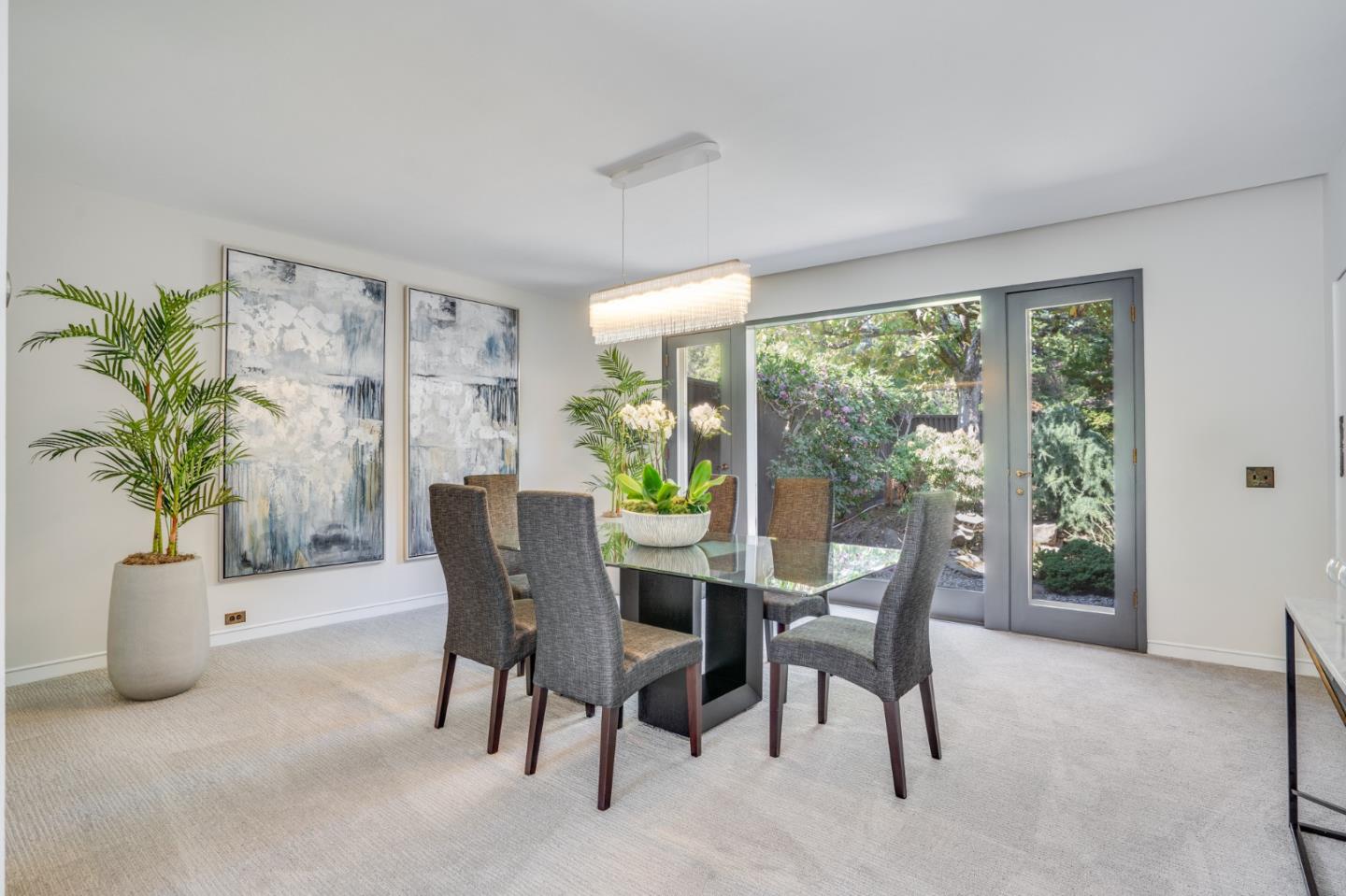 760 Chiltern Road Hillsborough, CA 94010 - Photo 15 of 56 a dining room with furniture and a potted plant