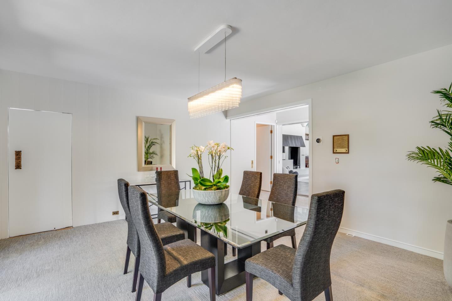 760 Chiltern Road Hillsborough, CA 94010 - Photo 16 of 56 a view of a dining room with furniture and wooden floor