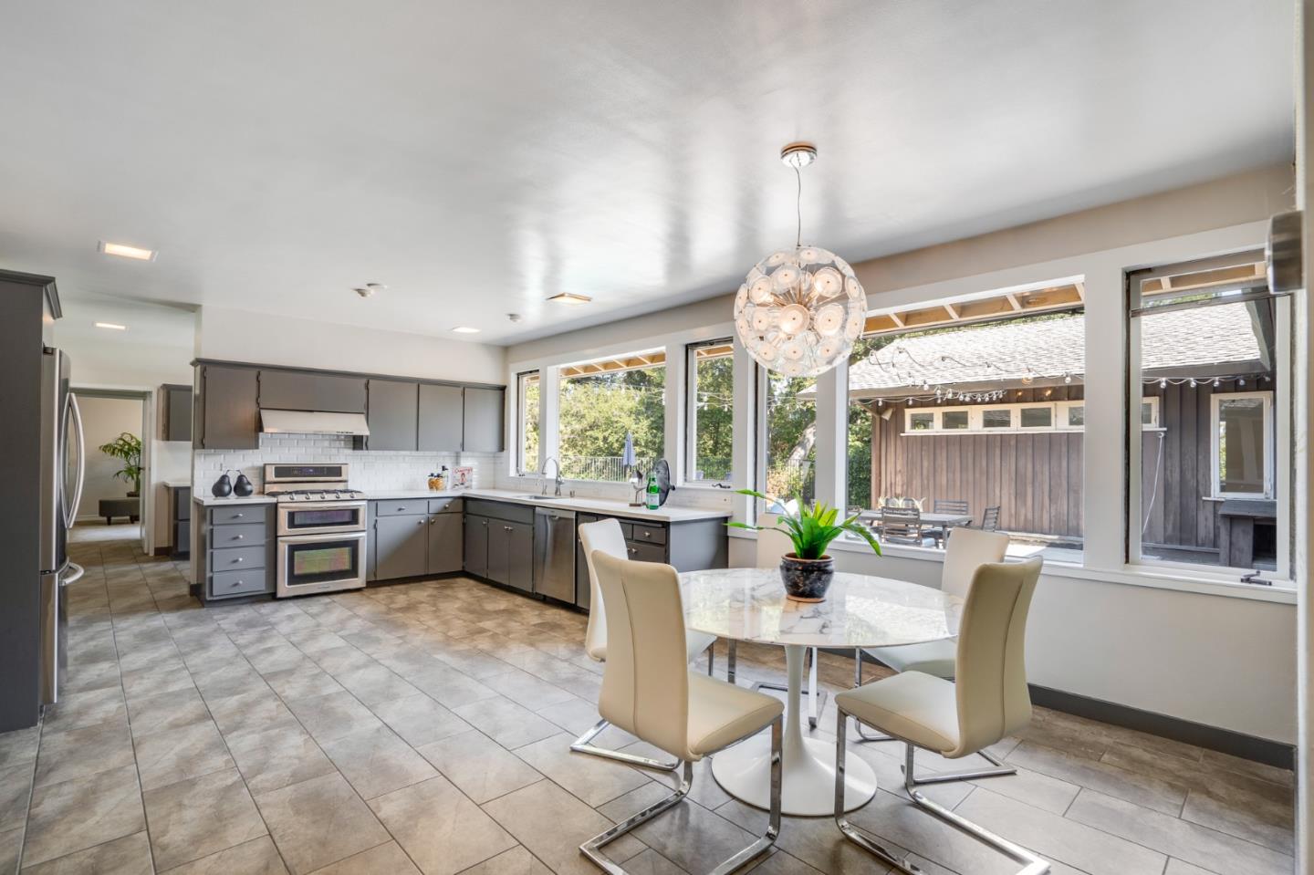 760 Chiltern Road Hillsborough, CA 94010 - Photo 17 of 56 a view of a dining room with furniture window and outside view