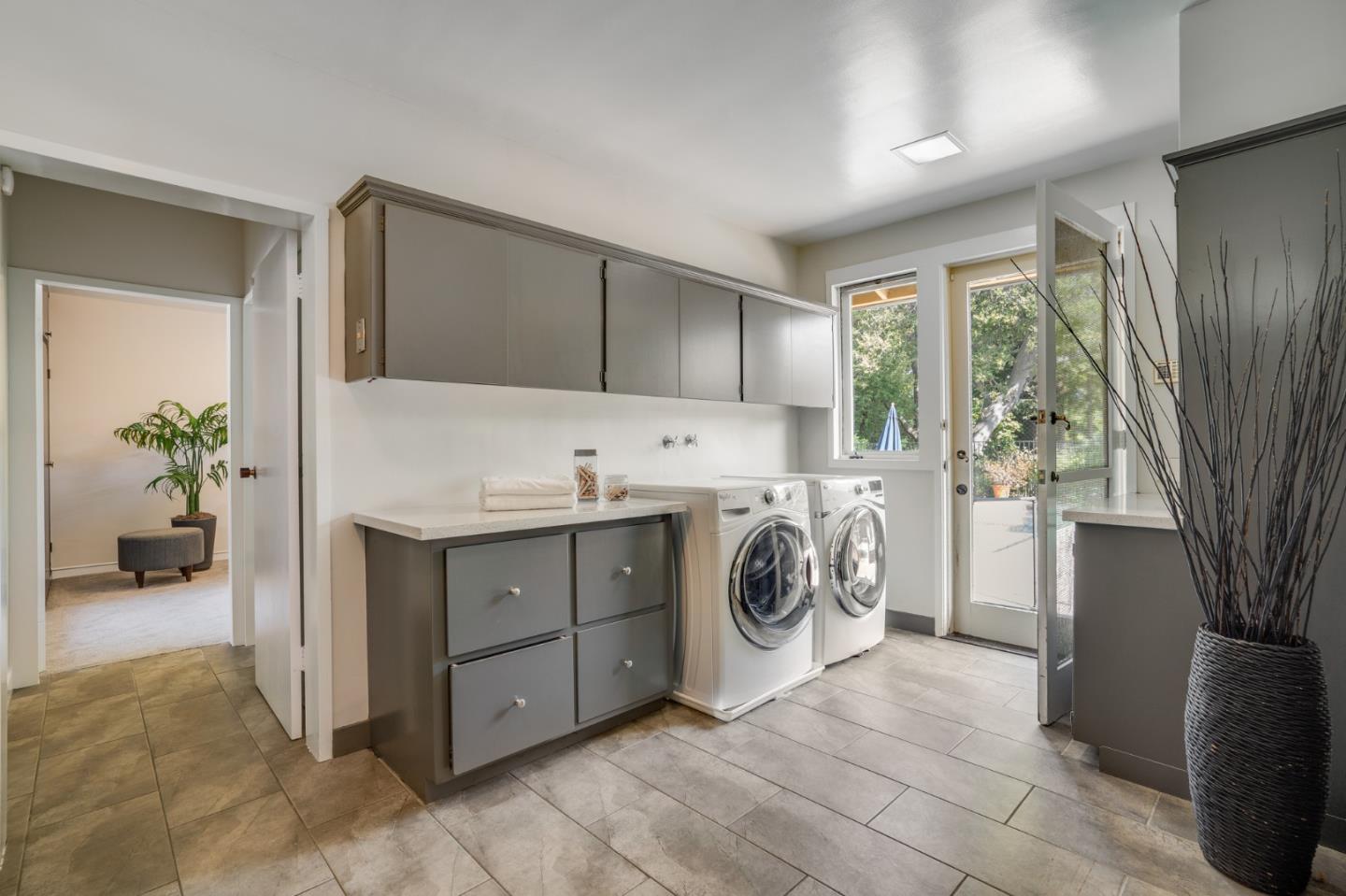 760 Chiltern Road Hillsborough, CA 94010 - Photo 20 of 56 a utility room with sink dryer and washer