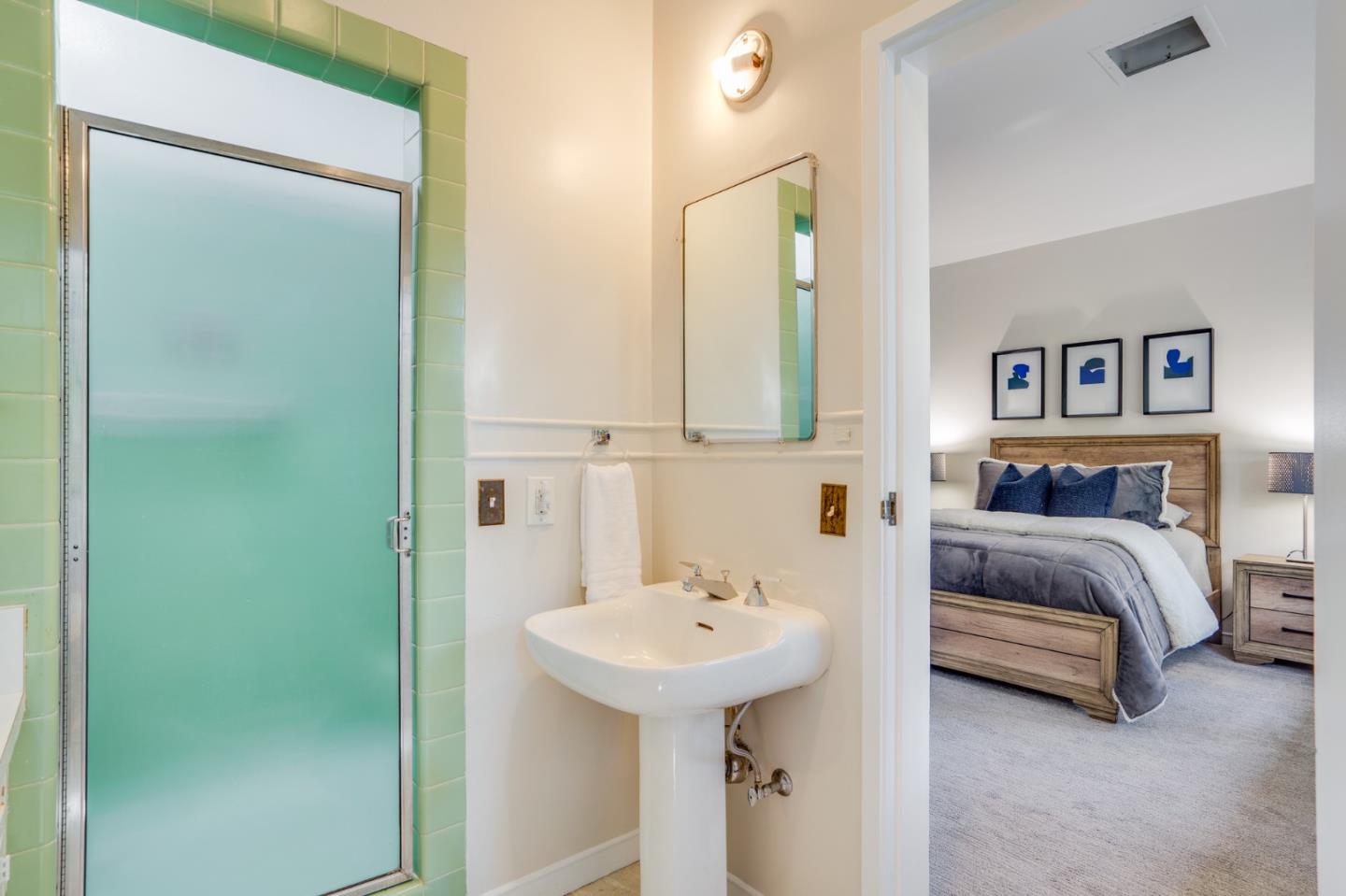 760 Chiltern Road Hillsborough, CA 94010 - Photo 27 of 56 a bedroom with a sink and a mirror