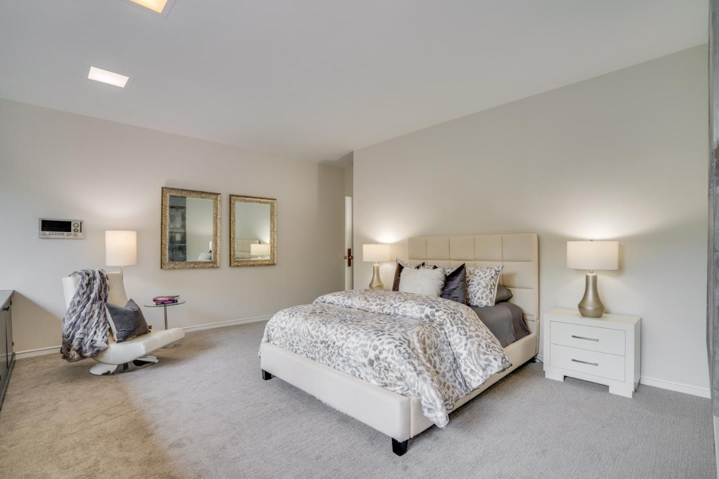 760 Chiltern Road Hillsborough, CA 94010 - Photo 31 of 56 a bedroom with a bed and a lamp