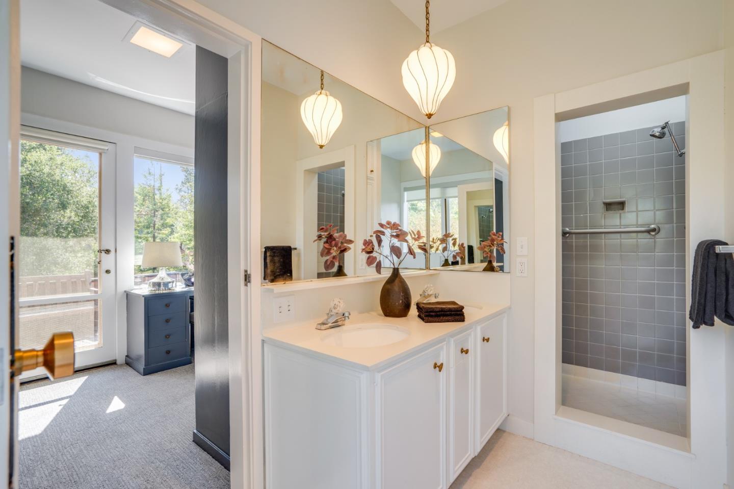 760 Chiltern Road Hillsborough, CA 94010 - Photo 33 of 56 a bathroom with a double vanity sink mirror and shower