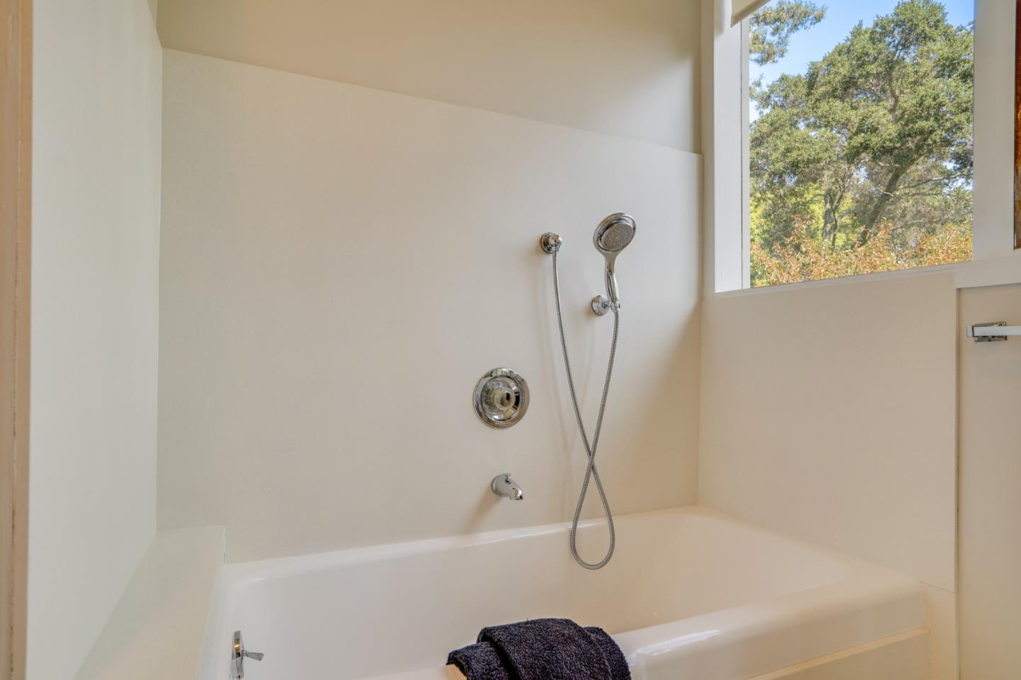 760 Chiltern Road Hillsborough, CA 94010 - Photo 34 of 56 a bathroom with a bathtub