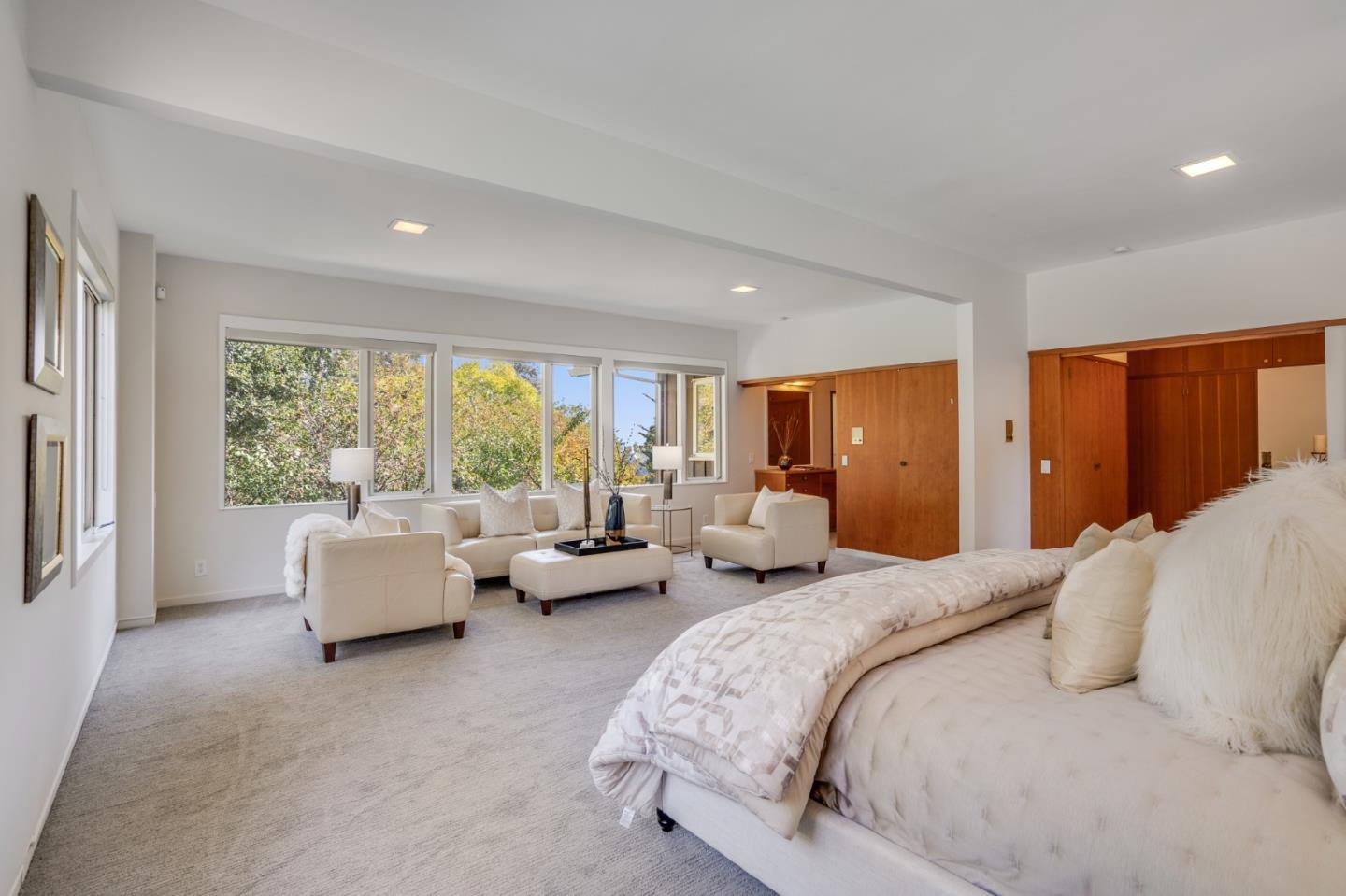 760 Chiltern Road Hillsborough, CA 94010 - Photo 37 of 56 a bedroom with bed couch and large window