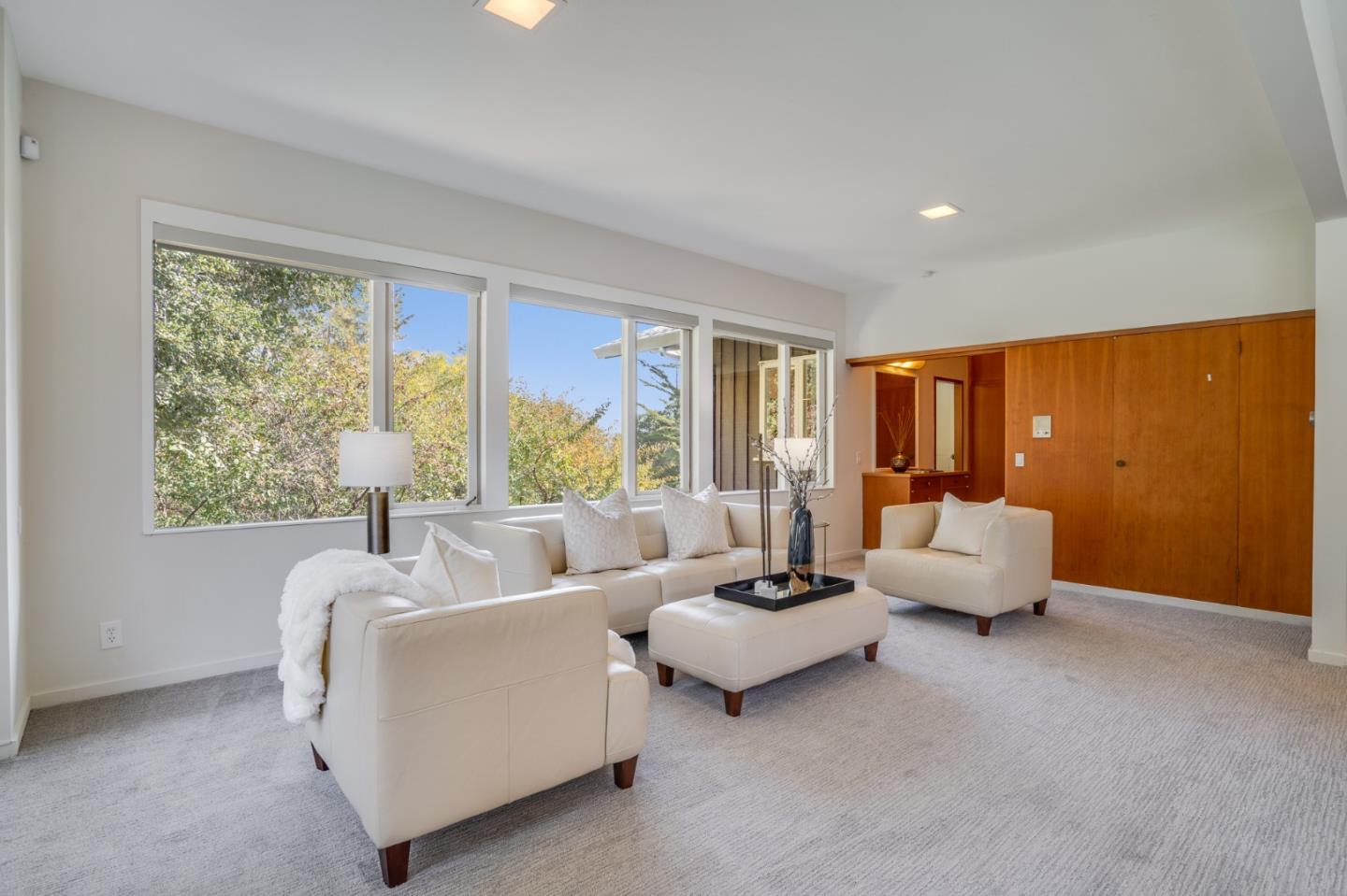 760 Chiltern Road Hillsborough, CA 94010 - Photo 38 of 56 a living room with furniture and a large window