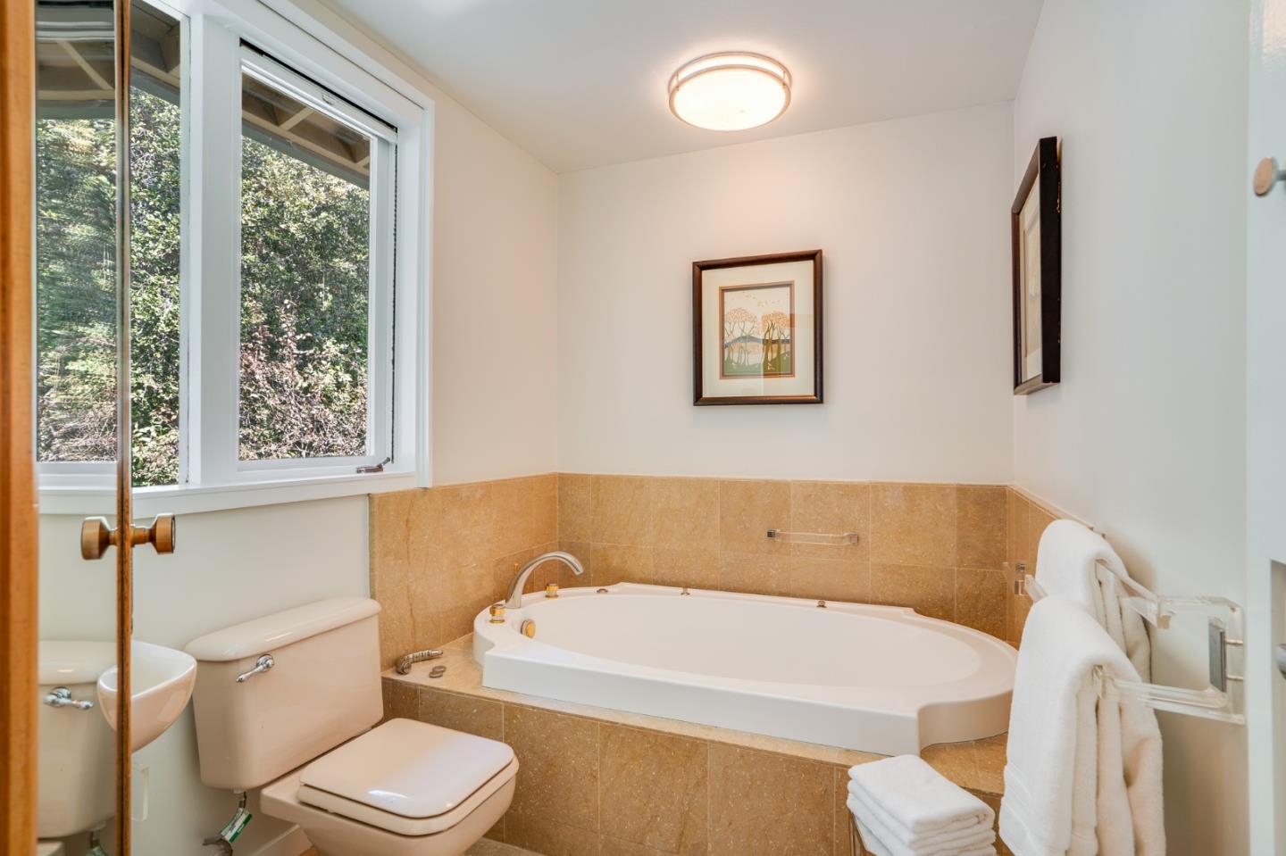 760 Chiltern Road Hillsborough, CA 94010 - Photo 39 of 56 a white bath tub sitting next to a white toilet