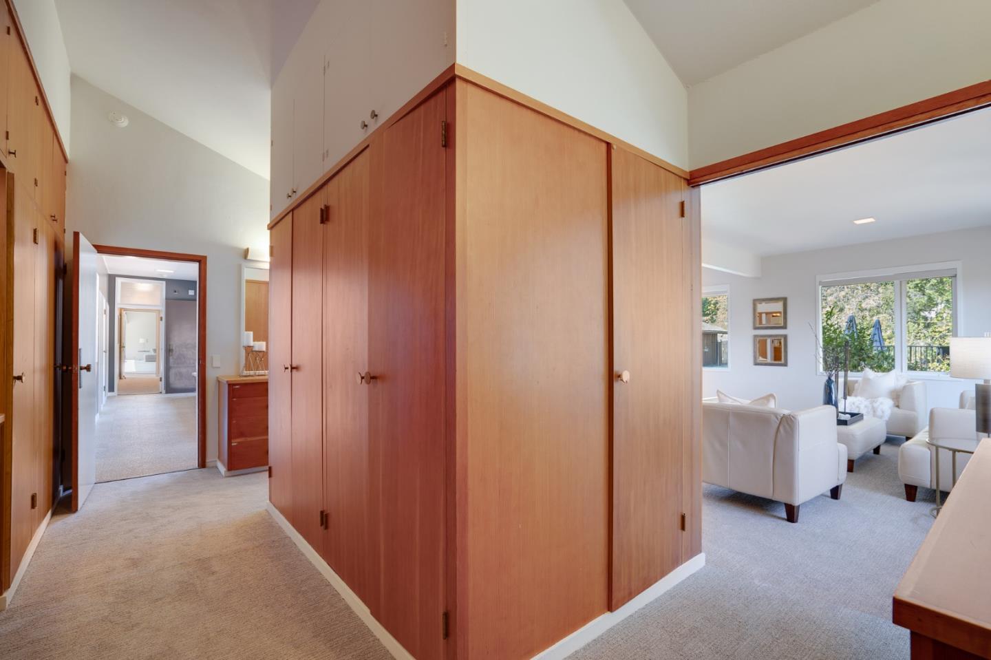 760 Chiltern Road Hillsborough, CA 94010 - Photo 40 of 56 a view of a hallway with furniture and windows