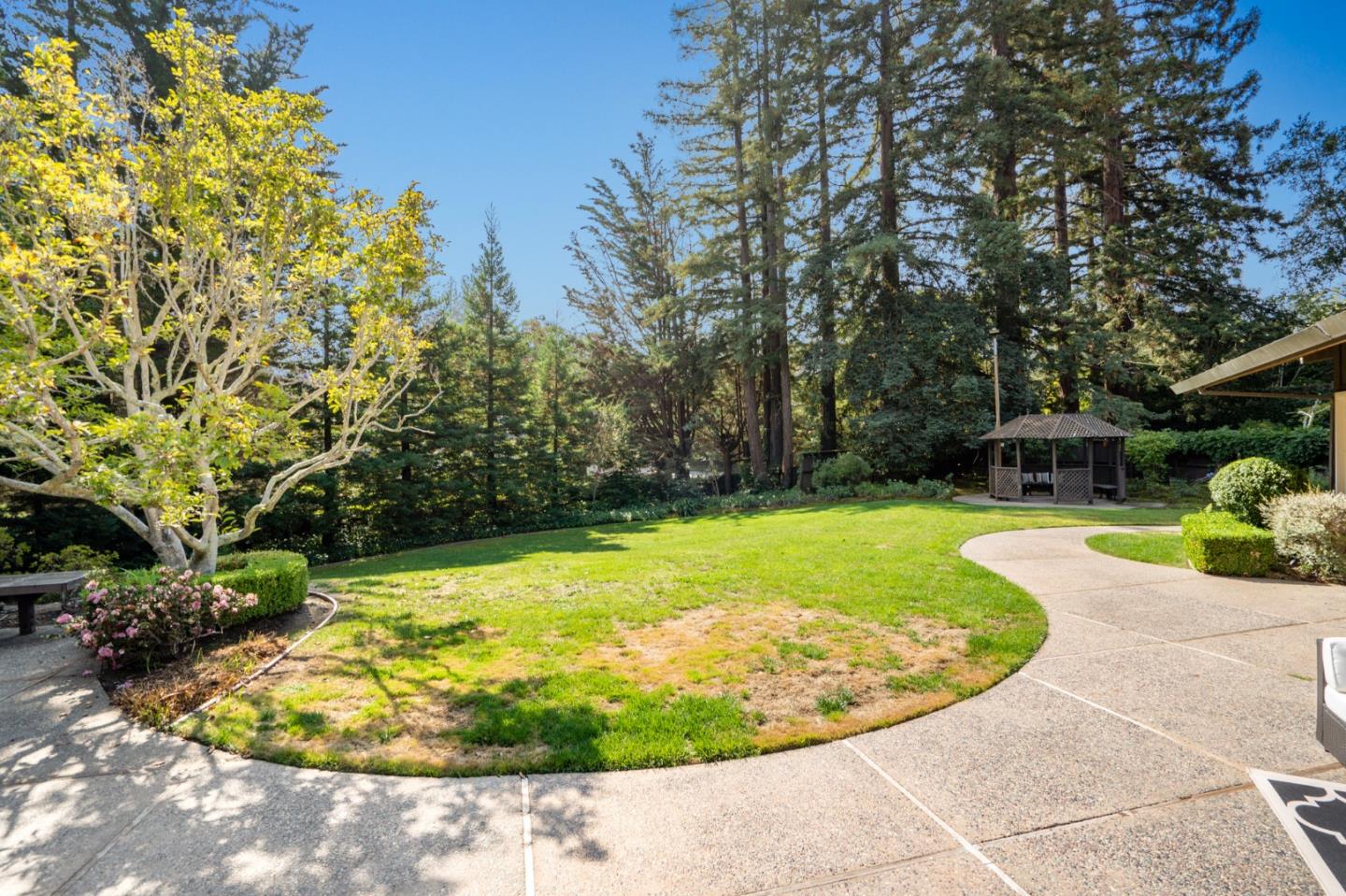 760 Chiltern Road Hillsborough, CA 94010 - Photo 48 of 56 a view of a swimming pool with a yard