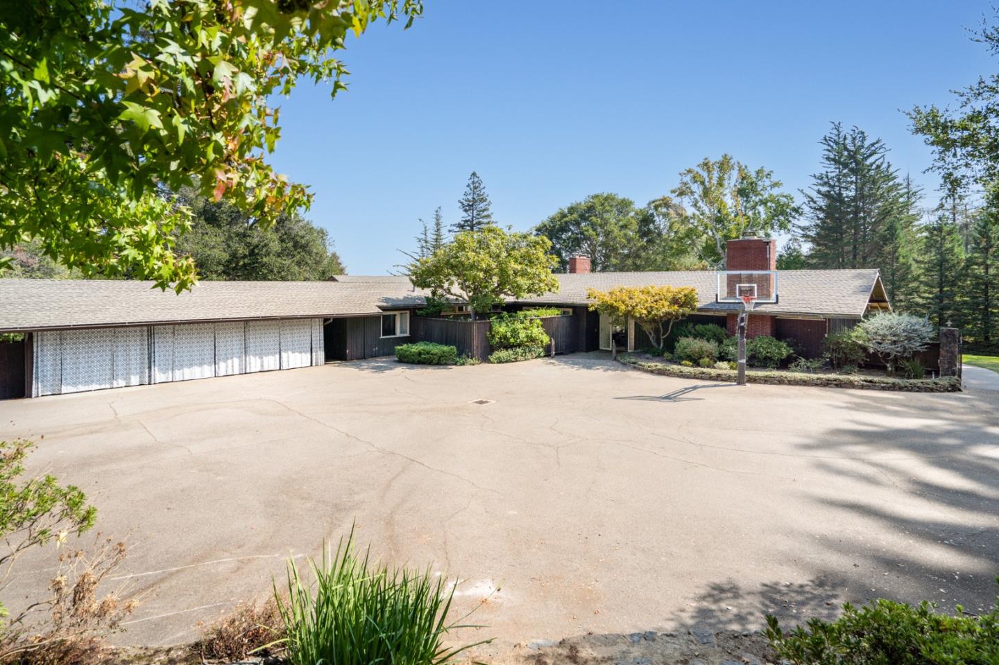 760 Chiltern Road Hillsborough, CA 94010 - Photo 55 of 56 a front view of a house with a yard and garage