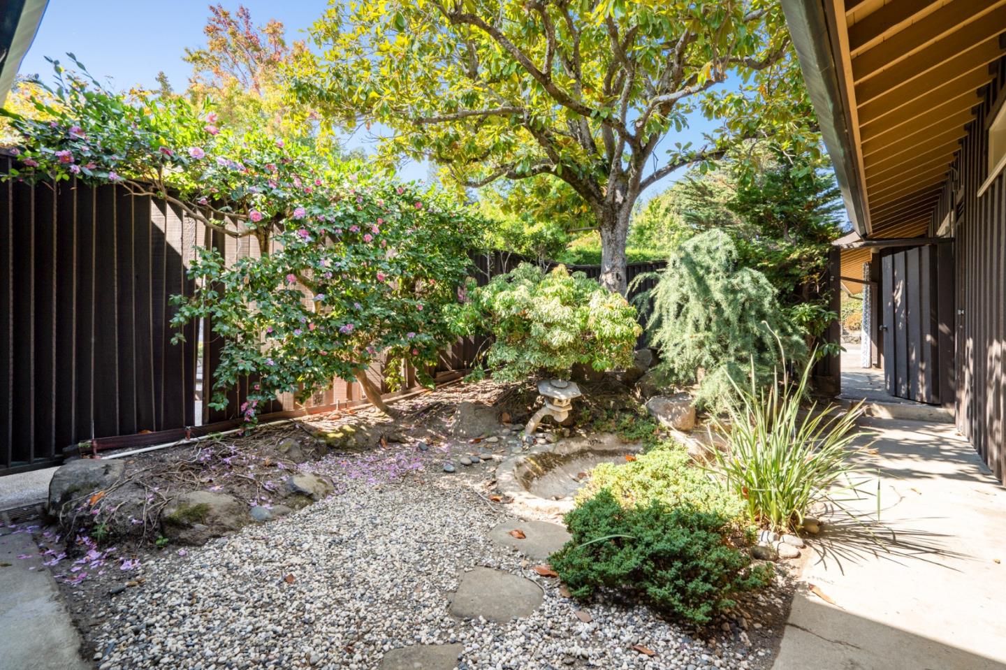 760 Chiltern Road Hillsborough, CA 94010 - Photo 56 of 56 a wooden bench sitting in front of a house