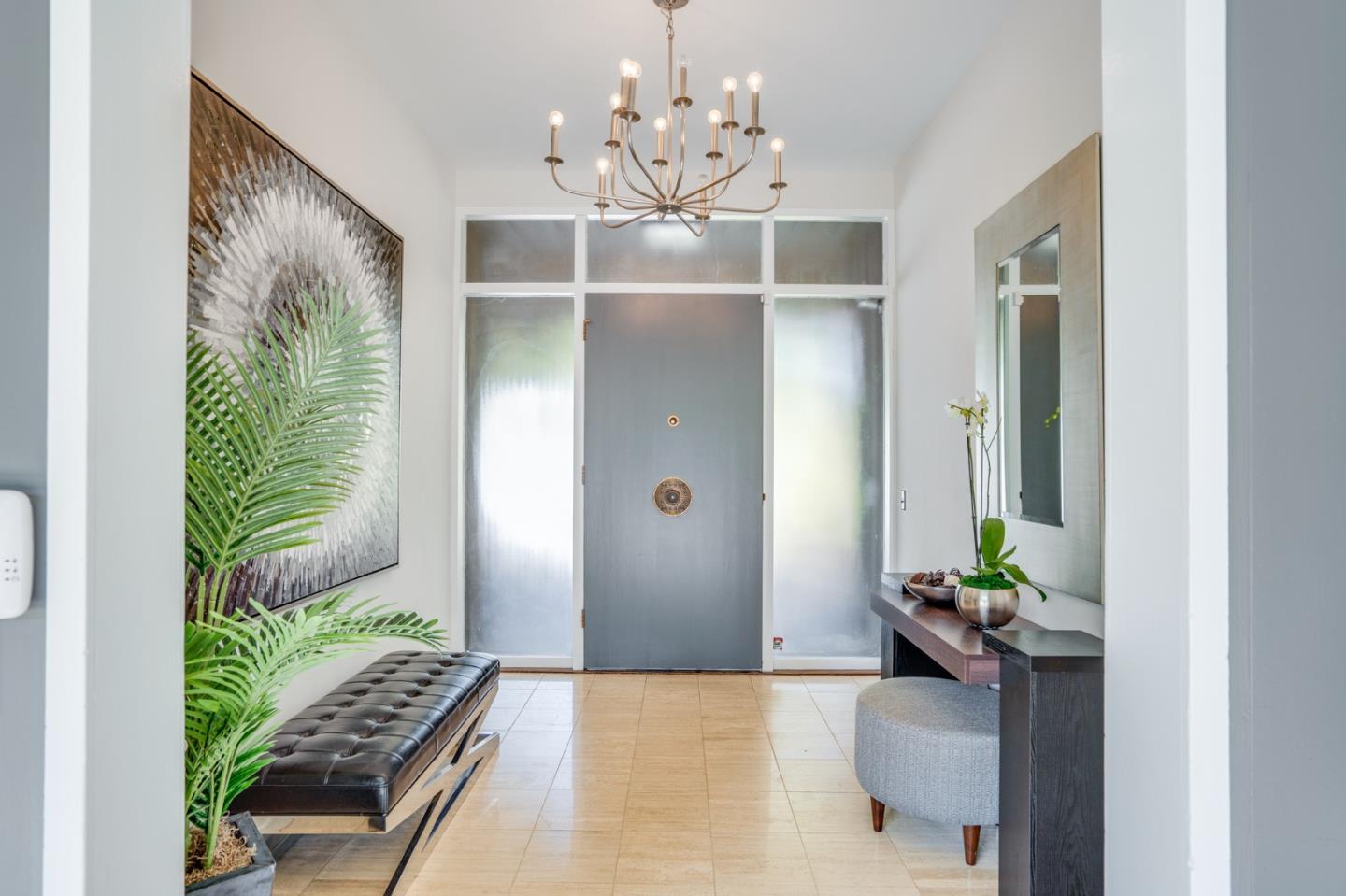 760 Chiltern Road Hillsborough, CA 94010 - Photo 6 of 56 a living room with furniture and a chandelier