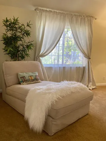 a bathroom with a sink a toilet and a shower curtain