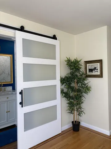 a view of a door with a flower pot on it