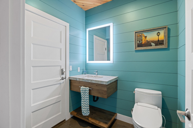 1263 Chapman Court Alpine, UT 84004 - Photo 65 of 83 Bathroom featuring vanity, wooden walls, and wood ceiling
