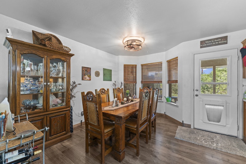 249 County Road 4961 Kempner, TX 76539 - Photo 11 of 31 a view of a dining room with furniture window and wooden floor