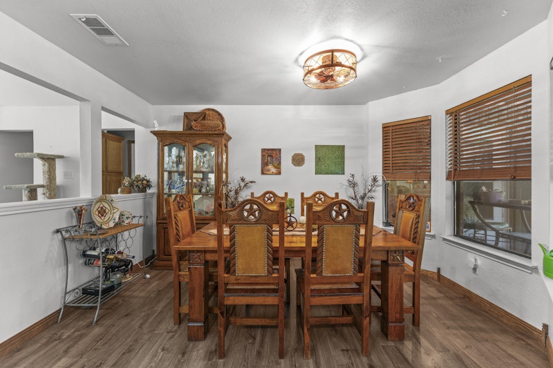 249 County Road 4961 Kempner, TX 76539 - Photo 12 of 31 a view of a dining room with furniture and wooden floor