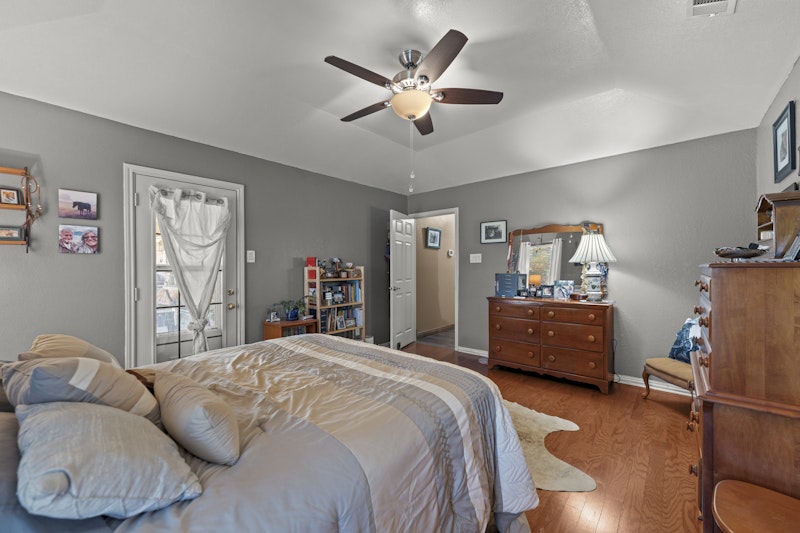 249 County Road 4961 Kempner, TX 76539 - Photo 17 of 31 a bedroom with a bed and wooden floor
