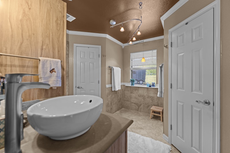 249 County Road 4961 Kempner, TX 76539 - Photo 18 of 31 a bathroom with a sink and mirror