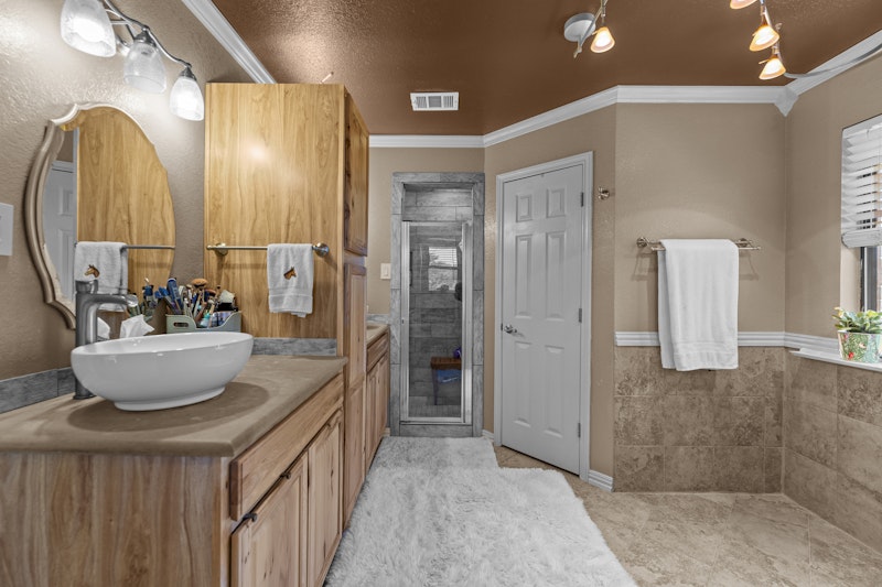 249 County Road 4961 Kempner, TX 76539 - Photo 20 of 31 a bathroom with a sink a toilet and a mirror