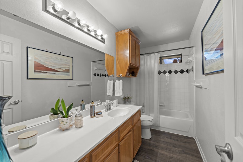 249 County Road 4961 Kempner, TX 76539 - Photo 22 of 31 a bathroom with a double vanity sink toilet and shower