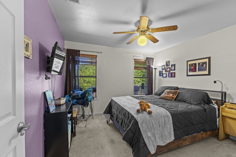 249 County Road 4961 Kempner, TX 76539 - Photo 23 of 31 a bedroom with a bed and a chandelier