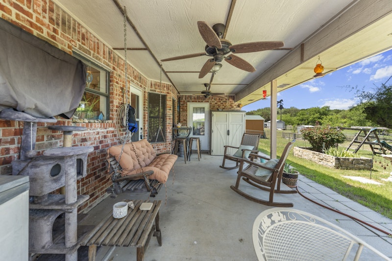 249 County Road 4961 Kempner, TX 76539 - Photo 24 of 31 a living room with furniture and a floor to ceiling window
