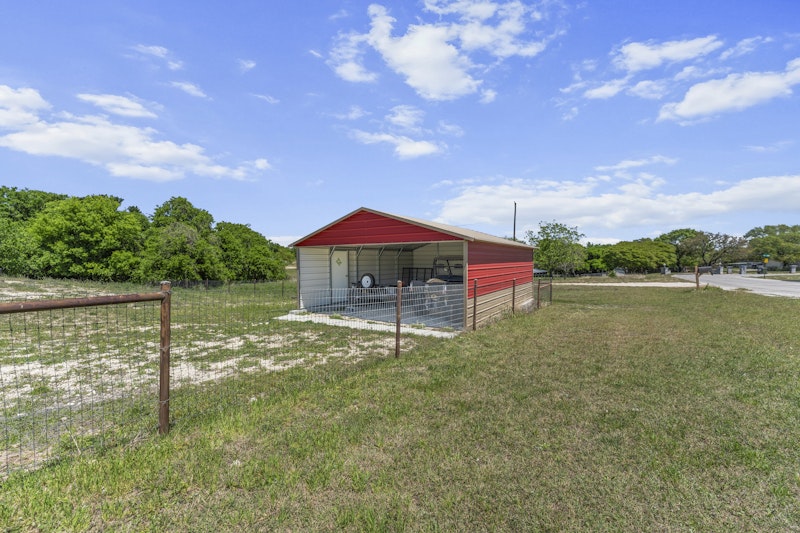 249 County Road 4961 Kempner, TX 76539 - Photo 28 of 31 a backyard of a house with lots of green space and lake view