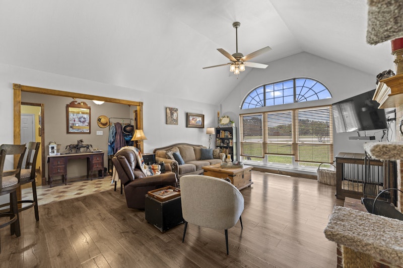 249 County Road 4961 Kempner, TX 76539 - Photo 8 of 31 a living room with fireplace furniture and a large window