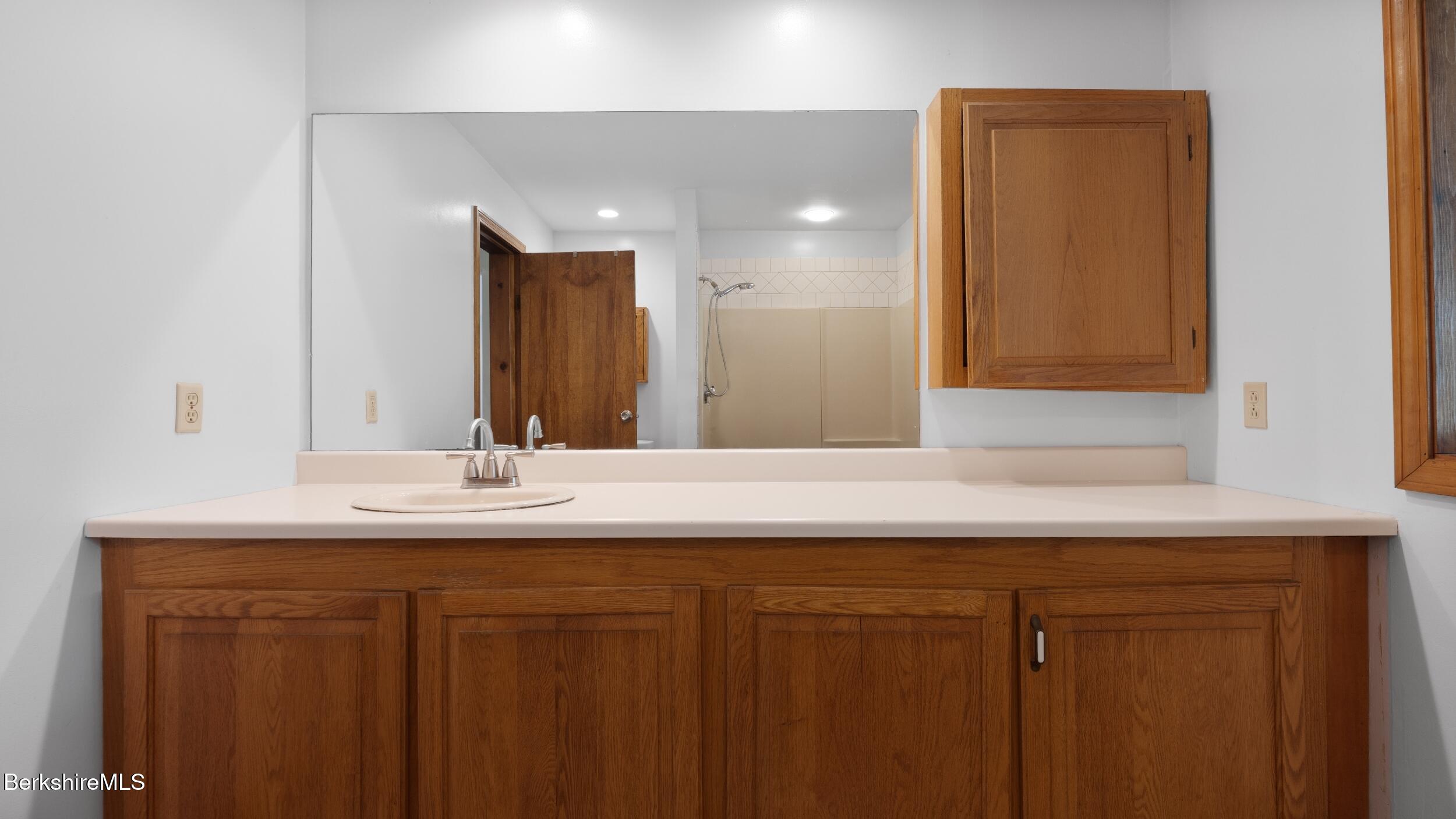 20 East Dugway Road Lenox, MA 01240 - Photo 12 of 84 a bathroom with a sink and a mirror