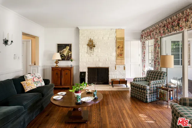 a kitchen with stainless steel appliances a large window a sink and a counter space