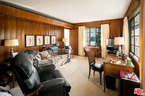 a kitchen with a refrigerator and a stove