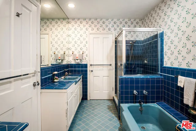 a view of a patio with table and chairs and potted plants