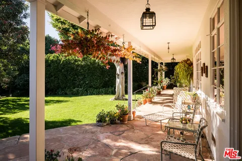 a view of an swimming pool with a yard