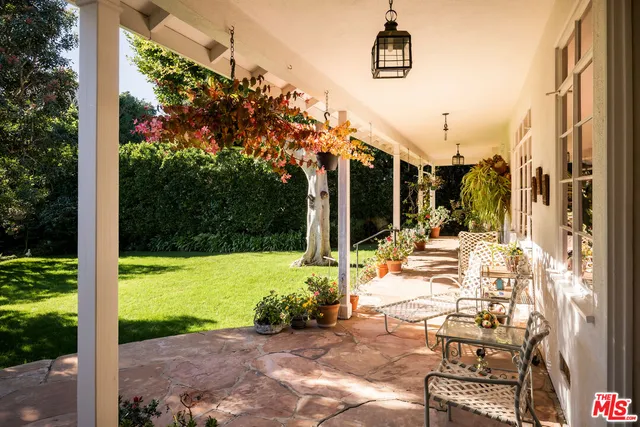 a view of an swimming pool with a yard