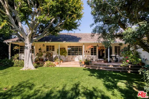 a view of outdoor space with deck and yard