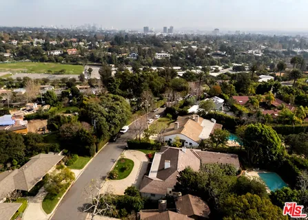 an aerial view of a house with a garden