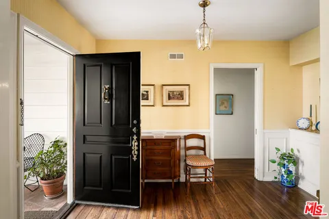a workspace with furniture and a potted plant