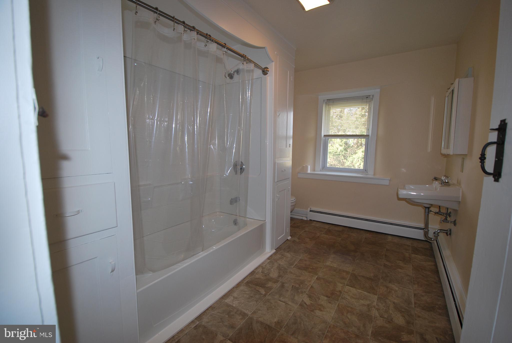 592 Blake Road Elkton, MD 21921 - Photo 13 of 18 a bathroom with a bathtub and a shower