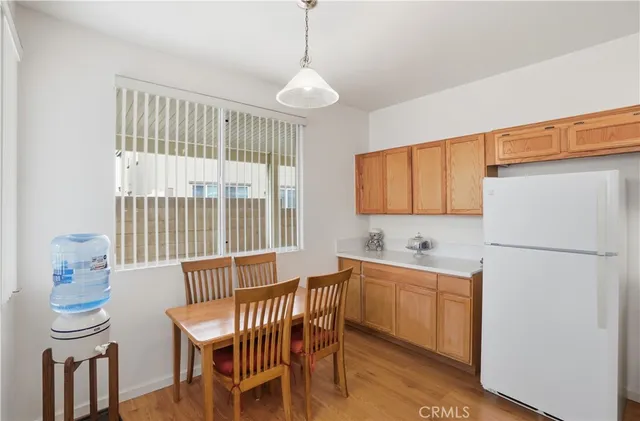 a dining room with a table and chairs