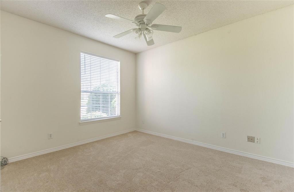4136 Los Altos Drive Plano, TX 75024 - Photo 18 of 31 an empty room with a window and a fan