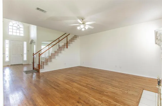 a view of an entryway with wooden floor