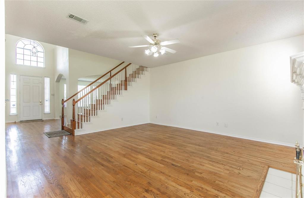 4136 Los Altos Drive Plano, TX 75024 - Photo 20 of 31 a view of an entryway with wooden floor
