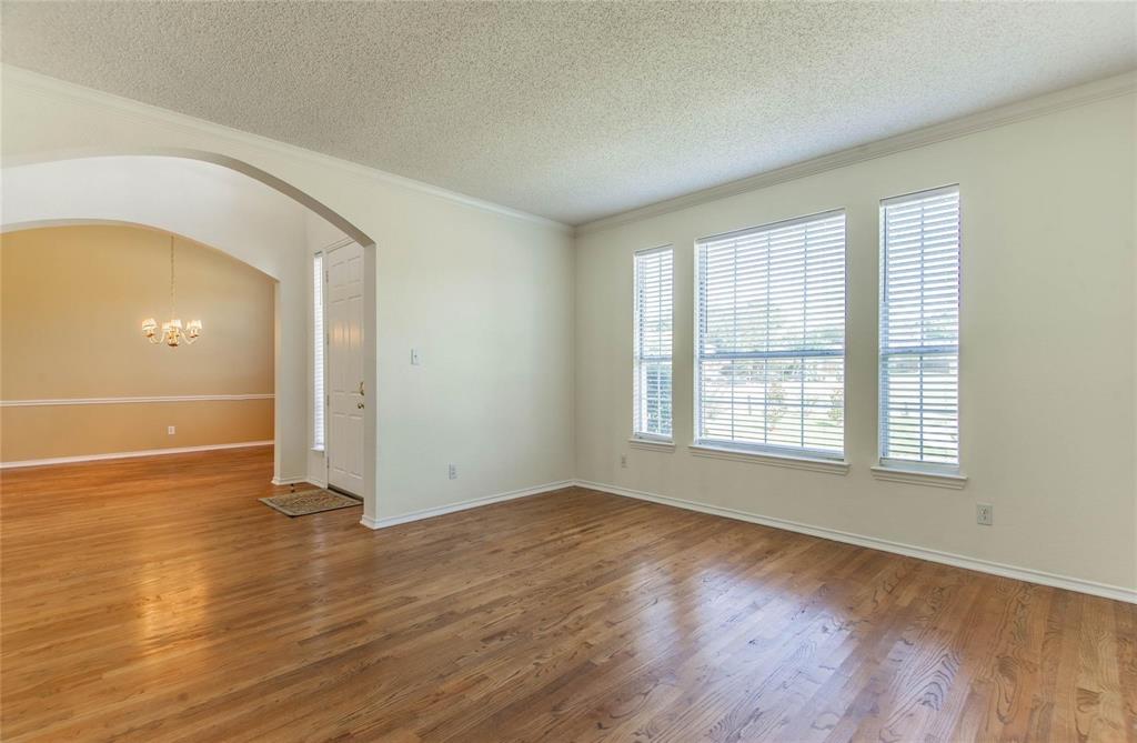 4136 Los Altos Drive Plano, TX 75024 - Photo 24 of 31 an empty room with wooden floor and windows