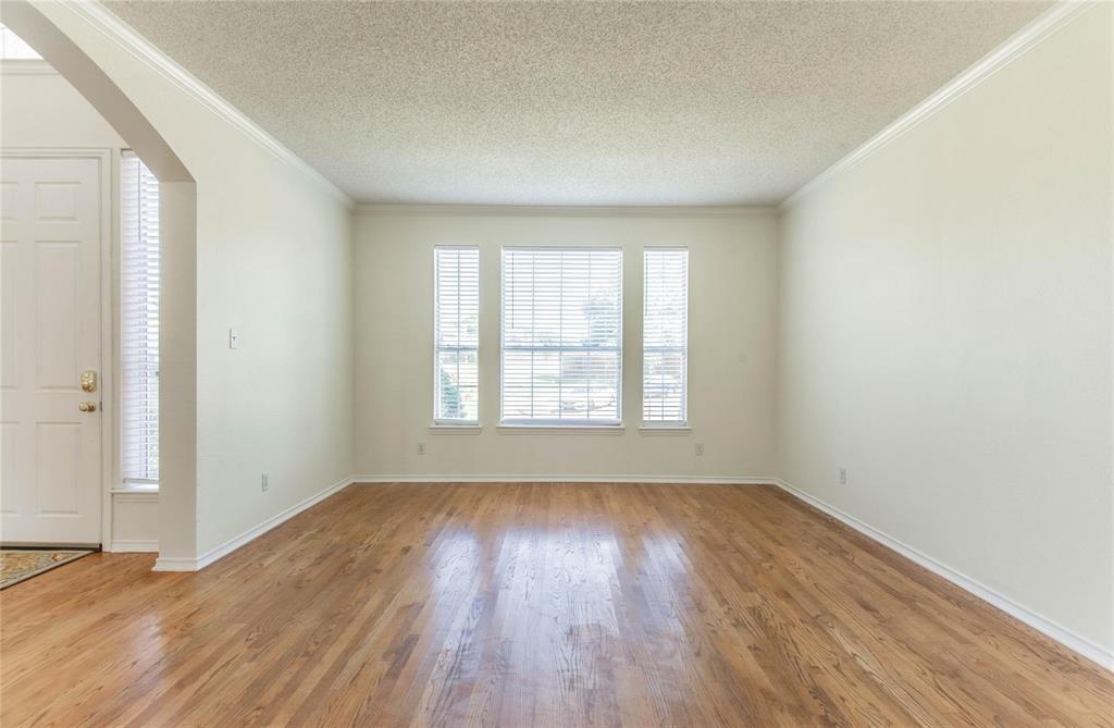 4136 Los Altos Drive Plano, TX 75024 - Photo 25 of 31 an empty room with wooden floor and windows